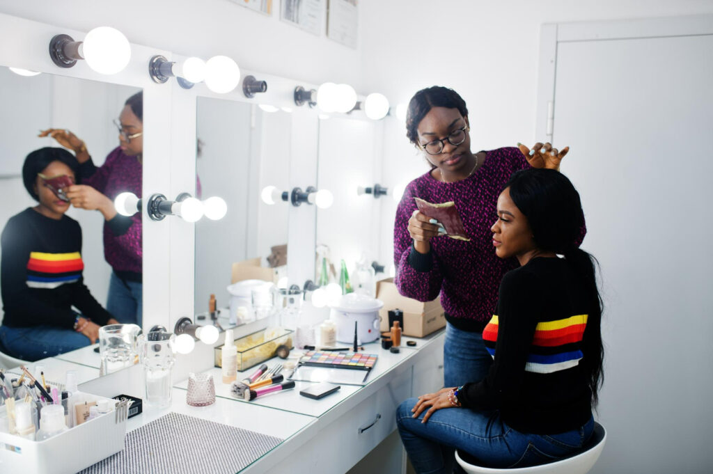 Nigerian beauty professional offering mobile beauty services with makeup tools, representing starting a beauty business without a physical shop.